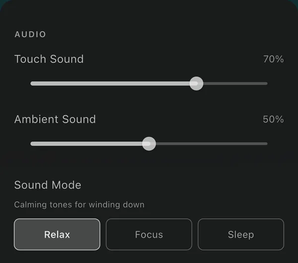 A dark settings screen under an AUDIO heading: sliders for Touch Sound at 70 per cent and Ambient Sound at 50 per cent, then a Sound Mode row with Relax selected next to Focus and Sleep.